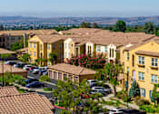 Thumbnail 72 of 80 - A residential area with houses and cars.