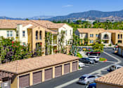Thumbnail 74 of 80 - A residential area with houses and cars.