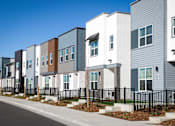 Thumbnail 49 of 50 - a row of town houses in front of a street