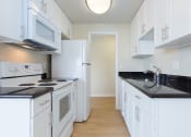 Thumbnail 48 of 86 - edgewood floor plan ktichen with white cabinets at Avenue Two Apartments, Redwood City  ,California, 94063