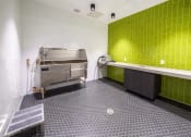 Thumbnail 13 of 24 - a kitchen with a stove and a counter at NoMa Apartments, Walnut Creek, CA