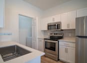 Thumbnail 22 of 57 - Chef-Inspired Kitchens Feature Stainless Steel Appliances at Arboretum at South Mountain, Phoenix