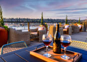 Thumbnail 2 of 33 - rooftop lounge with lake view and outdoor dining area