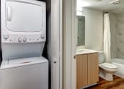 Thumbnail 28 of 33 - Washer/dryer next to full bath