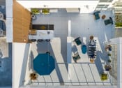 Thumbnail 41 of 89 - a birdseye view of a patio area with tables and umbrellas and a pool