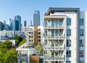 Thumbnail 44 of 89 - an image of an apartment building in san francisco with a cityscape in the background