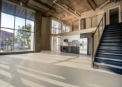 Thumbnail 53 of 89 - a large open space with a staircase and a kitchen