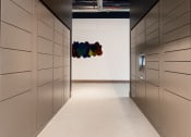 Thumbnail 66 of 89 - a row of lockers in a room with a colorful painting on the wall