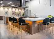 Thumbnail 77 of 89 - a kitchen with an island and stools