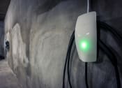 Thumbnail 81 of 89 - a power adapter plugged into a wall with a green light shining on it