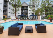 Thumbnail 18 of 36 - Pool area seating at 55+ FountainGlen Goldenwest, Westminster, CA