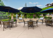 Thumbnail 21 of 28 - BBQ Deck Seating Area at 55+ FountainGlen Jacaranda, Fullerton, CA