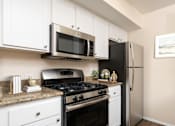 Thumbnail 1 of 23 - Apartment kitchen at FountainGlen Pasadena