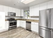 Thumbnail 14 of 22 - Community Clubhouse Kitchen at 55+ FountainGlen Seacliff, California