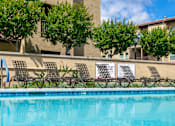 Thumbnail 11 of 22 - Chaise lounges at pool area FountainGlen Stevenson Ranch