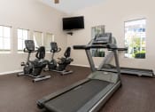 Thumbnail 30 of 34 - fitness center treadmill and recumbent bikes at 55+ FountainGlen Valencia, Valencia, CA, 91354