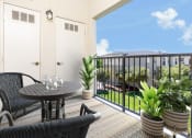 Thumbnail 7 of 34 - a patio with a table and chairs on a balcony at 55+ FountainGlen Valencia, California