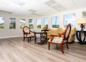 Thumbnail 32 of 34 - room with table sofa and chairs at 55+ FountainGlen Valencia, Valencia, CA, 91354