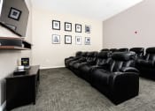 Thumbnail 26 of 34 - theater room with tv and leather chairs at 55+ FountainGlen Valencia, Valencia, California