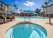 Thumbnail 15 of 28 - Circular pool at 55+ FountainGlen Grand Isle, California, 92562