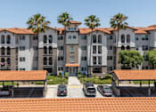 Thumbnail 31 of 34 - A building with a parking lot in front of it. at 55+ FountainGlen Terra Vista, Rancho Cucamonga, 91730