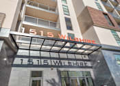 Thumbnail 22 of 26 - The Wilshire building has a modern design with a glass facade at Wilshire Valencia Apartment, Los Angeles, CA, 90017
