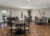 Thumbnail 25 of 25 - a dining room with tables and chairs at 55+ Remington at Ladera Ranch, Ladera Ranch, CA, 92694