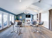 Thumbnail 6 of 28 - a living room with tables and chairs and a fireplace at Harbor Pointe, Dana Point, CA, 92629