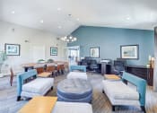 Thumbnail 7 of 28 - a large living room with tables and chairs and a desk with a computer at Harbor Pointe, California, 92629