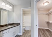 Thumbnail 22 of 28 - a bathroom with a mirror and a sink and a toilet at Harbor Pointe, Dana Point, CA