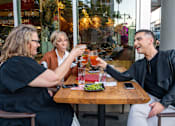 Thumbnail 30 of 68 - People with drinks outside of a local rest at Imperial Hardware Lofts, California, 92501