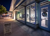 Thumbnail 28 of 68 - Sign on the sidewalk outside of building in the evening at Imperial Hardware Lofts, California