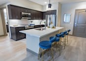 Thumbnail 74 of 83 - furnished kitchen with stool seating at Bayswater Apartments, Burlingame, CA