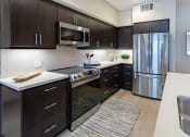 Thumbnail 73 of 83 - furnished kitchen with stainless steel appliances at Bayswater Apartments, Burlingame, CA
