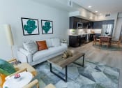 Thumbnail 2 of 83 - Living Room With Sofa, Coffee Table, Area Rug, Chairs And Floor Lamp. at Bayswater Apartments, Burlingame