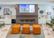 Thumbnail 24 of 83 - resident lounge with HD tv and fireplace at Bayswater Apartments, Burlingame, 94010