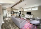 Thumbnail 22 of 97 - casata model with a living room with couches a coffee table and a tv