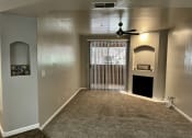 Thumbnail 13 of 18 - Livingroom with fireplace and ceilin fan