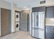 Thumbnail 46 of 83 - Stainless steel fridge and in unit washer and dryer at Bayswater Apartments, Burlingame, CA