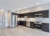 Thumbnail 44 of 83 - Kitchen with stainless steel appliances at Bayswater Apartments, Burlingame, 94010