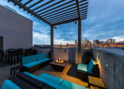 Thumbnail 31 of 34 - Rooftop Deck With Fire Pit, Plush Seating, Tables, Chairs, And Amazing Views Of The City at Waterford RiNo, Denver, CO