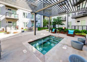 Thumbnail 29 of 34 - Jacuzzi Area with Seating Area Under Wooden Canopy at Waterford RiNo, Denver, Colorado