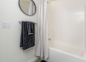 Thumbnail 66 of 68 - a bathroom with a shower and a tub and a mirror at Imperial Hardware Lofts, California