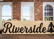 Thumbnail 62 of 68 - a wooden sign with the word rutherford in front of a building at Imperial Hardware Lofts, Riverside, CA, 92501