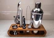 Thumbnail 65 of 68 - a wooden cutting board with various kitchen utensils on a kitchen counter at Imperial Hardware Lofts, Riverside, CA, 92501
