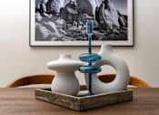Thumbnail 67 of 68 - a table with two vases and a toothbrush on it at Imperial Hardware Lofts, Riverside, CA