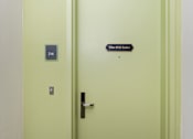 Thumbnail 68 of 68 - a white door with a sign on the side of it at Imperial Hardware Lofts, Riverside, CA, 92501