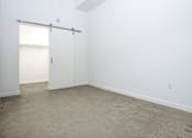 Thumbnail 18 of 68 - room with barn sliding door and white walls at Imperial Hardware Lofts, Riverside