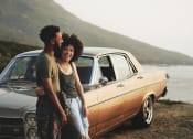 Thumbnail 44 of 52 - a man and woman standing in front of a car at North Grove, California  