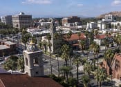 Thumbnail 52 of 52 - a view of a city with palm trees and a clock tower at North Grove, California, 92501